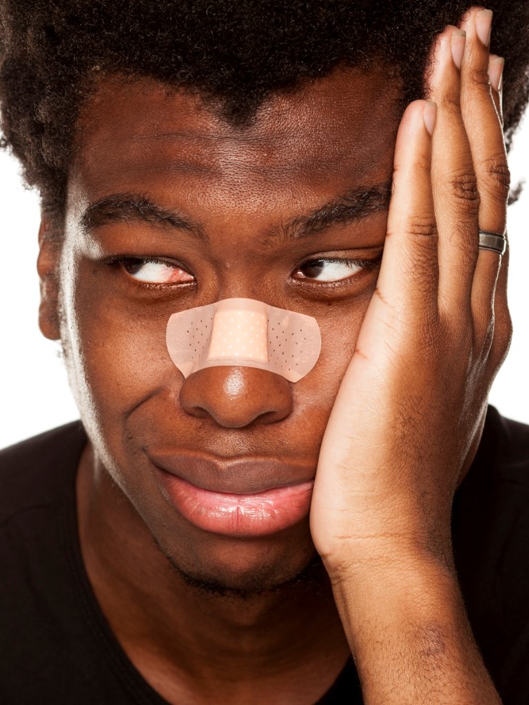 https://www.entincayman.com/wp-content/uploads/portrait-of-young-african-american-man-with-bandage-tape-over-his-on-picture-id1049255998.jpg